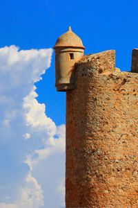 Preview wallpaper tower, wall, building, architecture, sky, clouds
