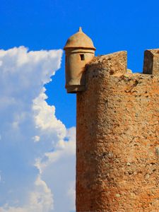 Preview wallpaper tower, wall, building, architecture, sky, clouds