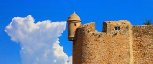 Preview wallpaper tower, wall, building, architecture, sky, clouds