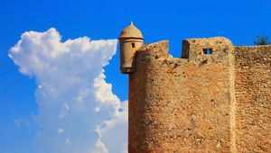 Preview wallpaper tower, wall, building, architecture, sky, clouds