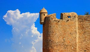 Preview wallpaper tower, wall, building, architecture, sky, clouds