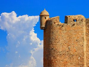 Preview wallpaper tower, wall, building, architecture, sky, clouds