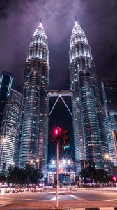 Preview wallpaper towers, buildings, architecture, city, night, traffic light