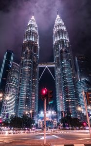 Preview wallpaper towers, buildings, architecture, city, night, traffic light