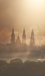 Preview wallpaper towers, buildings, fog, trees