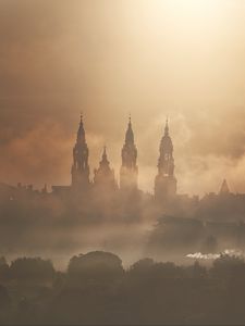 Preview wallpaper towers, buildings, fog, trees