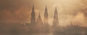 Preview wallpaper towers, buildings, fog, trees