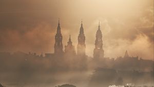 Preview wallpaper towers, buildings, fog, trees
