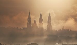 Preview wallpaper towers, buildings, fog, trees