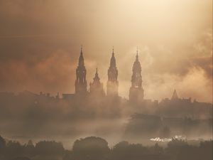 Preview wallpaper towers, buildings, fog, trees