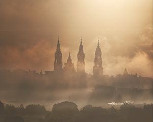 Preview wallpaper towers, buildings, fog, trees