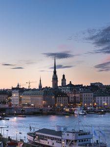 Preview wallpaper towers, buildings, lights, river, boat, twilight