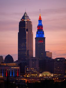 Preview wallpaper towers, buildings, lights, city, twilight