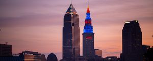 Preview wallpaper towers, buildings, lights, city, twilight