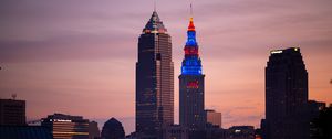 Preview wallpaper towers, buildings, lights, city, twilight