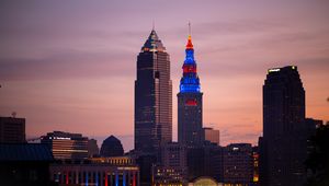 Preview wallpaper towers, buildings, lights, city, twilight