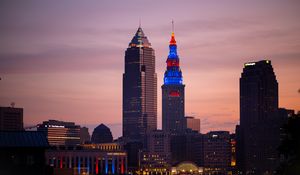 Preview wallpaper towers, buildings, lights, city, twilight