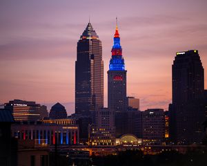 Preview wallpaper towers, buildings, lights, city, twilight