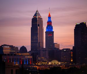 Preview wallpaper towers, buildings, lights, city, twilight
