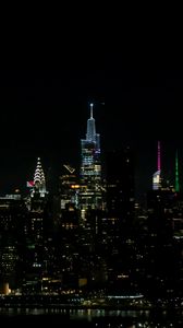 Preview wallpaper towers, buildings, lights, night, city