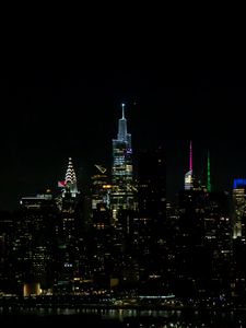 Preview wallpaper towers, buildings, lights, night, city