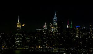 Preview wallpaper towers, buildings, lights, night, city