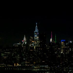 Preview wallpaper towers, buildings, lights, night, city