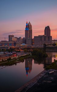 Preview wallpaper towers, buildings, river, reflection, city