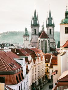 Preview wallpaper towers, buildings, roofs, architecture, street, city