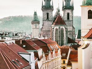 Preview wallpaper towers, buildings, roofs, architecture, street, city