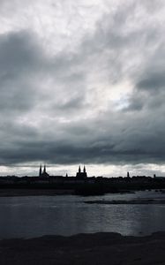 Preview wallpaper towers, buildings, silhouettes, river, evening