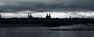 Preview wallpaper towers, buildings, silhouettes, river, evening