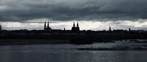 Preview wallpaper towers, buildings, silhouettes, river, evening