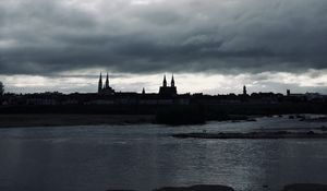 Preview wallpaper towers, buildings, silhouettes, river, evening