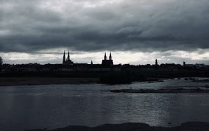 Preview wallpaper towers, buildings, silhouettes, river, evening