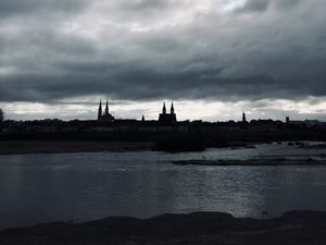 Preview wallpaper towers, buildings, silhouettes, river, evening