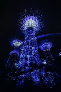 Preview wallpaper towers, glow, purple, plants