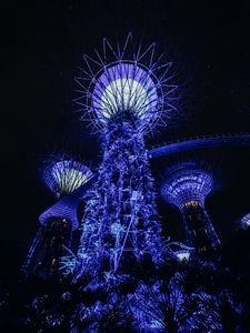 Preview wallpaper towers, glow, purple, plants