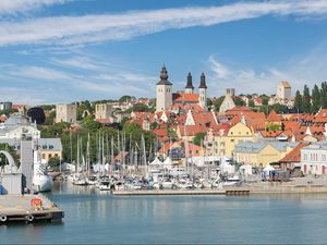 Preview wallpaper towers, houses, sea, bay, city, architecture