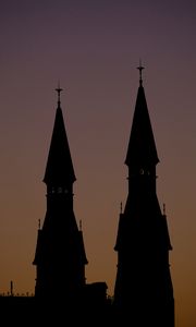 Preview wallpaper towers, silhouettes, evening, sunset, dark