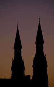 Preview wallpaper towers, silhouettes, evening, sunset, dark