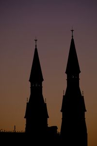 Preview wallpaper towers, silhouettes, evening, sunset, dark