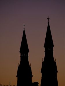 Preview wallpaper towers, silhouettes, evening, sunset, dark