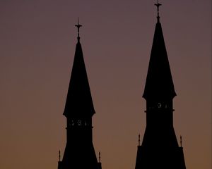 Preview wallpaper towers, silhouettes, evening, sunset, dark