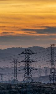 Preview wallpaper towers, wires, mountains, sky, sunset