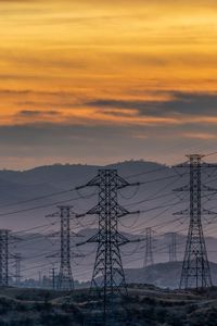 Preview wallpaper towers, wires, mountains, sky, sunset