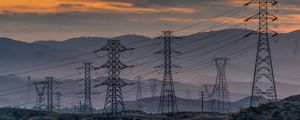 Preview wallpaper towers, wires, mountains, sky, sunset