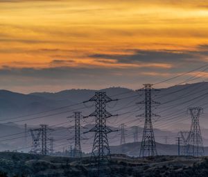 Preview wallpaper towers, wires, mountains, sky, sunset