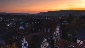 Preview wallpaper town, buildings, aerial view, architecture, sunset, twilight