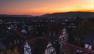 Preview wallpaper town, buildings, aerial view, architecture, sunset, twilight